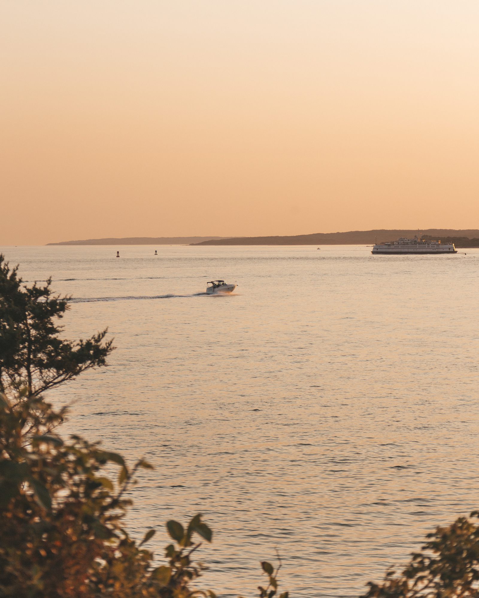 Calm bay at sunset with a boat