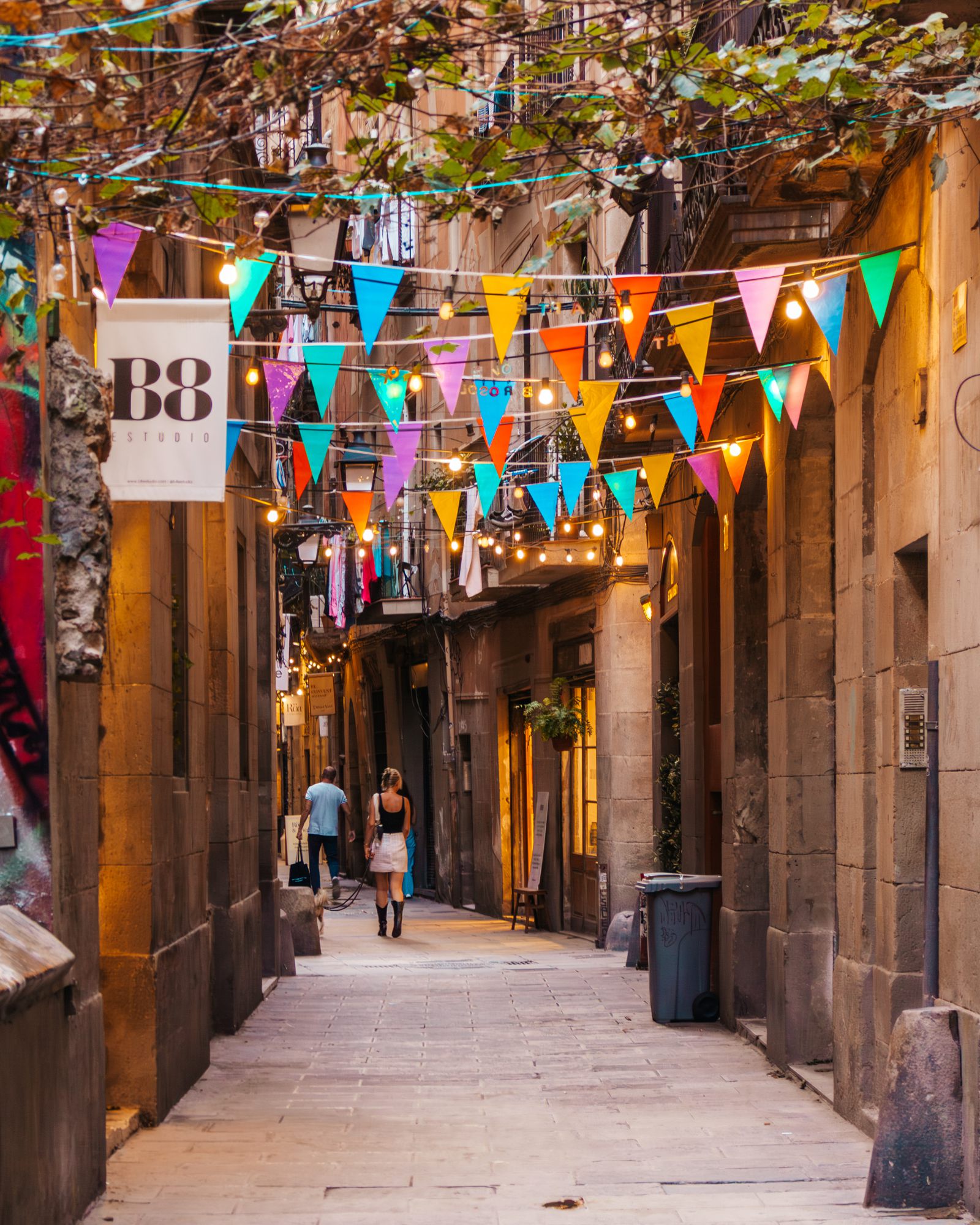 Narrow street with colourful bunting overhead