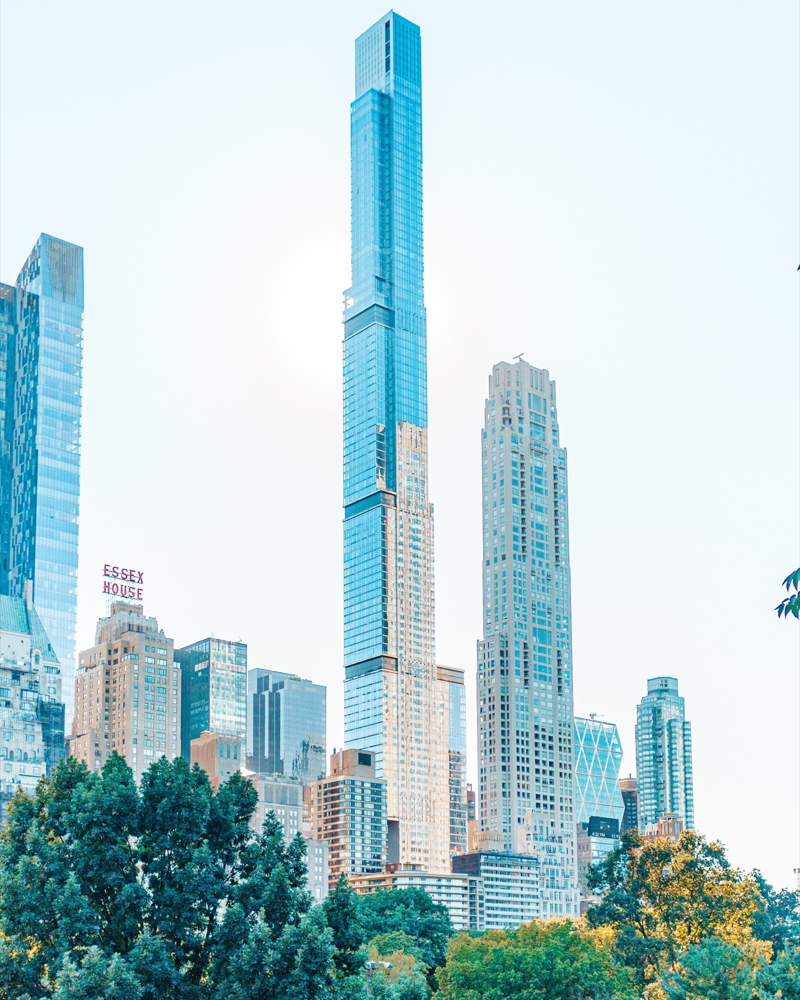 Supertall towers rising above Central Park trees
